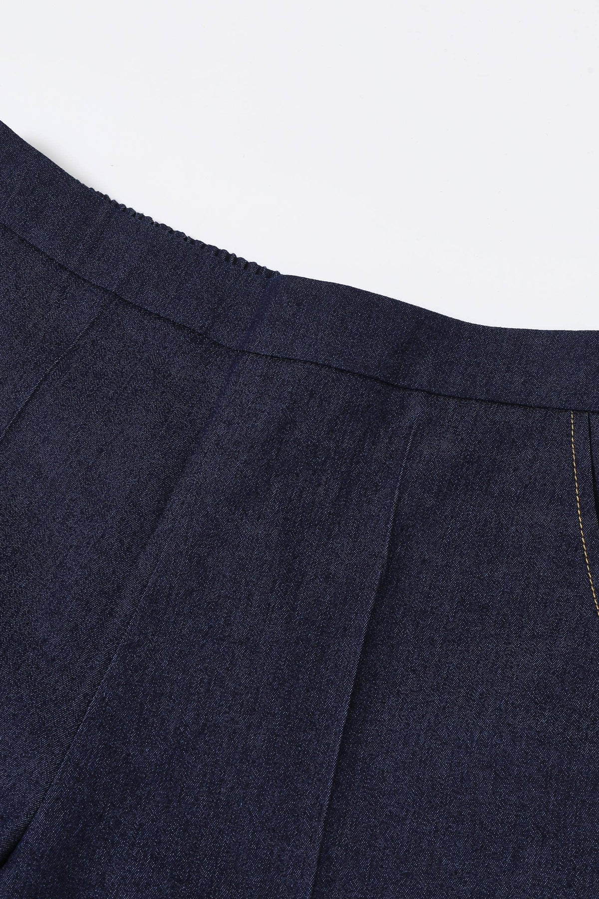 Close-up of a navy blue fabric with a white background